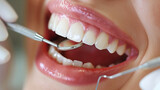 Fototapeta  - Dental examination with a focus on healthy white teeth and dental instruments