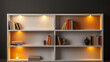 White shelves with orange lighting and books, vase, candle and sculpture.