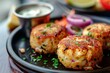 Delicious Crab Cakes Garnished with Fresh Herbs and Citrus