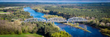 Fototapeta Miasto - Railway bridge over the Bug river, aerial landscape
