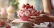strawberry frosted cupcake with hand adornment woman preparing a birthday cake