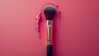 A minimalist composition featuring a single makeup brush set against a monochromatic background, i