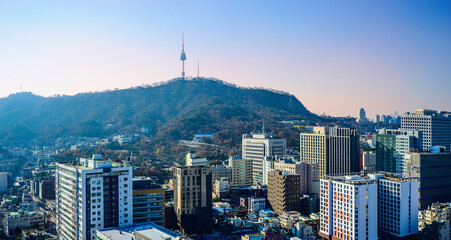 Wall Mural - Seoul City Downtown Skyline with modern skyscrapers, buildings under construction, traditional houses, Namsan Tower, and Namsan Mountain National Park area in South Korea