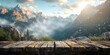 © jxvxnism - wooden tabletop with blurred background mountains with dappled sunlight, background for product advertising or product showcase