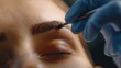 Close-up of brow tinting procedure