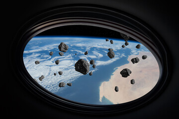 Wall Mural - earth and asteroids. asteroids fly over the earth, as seen from the window of a spaceship. elements 