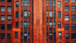 Standing out a its neighboring buildings a vibrant orange art deco structure boasts bold lines and dramatic shapes. Its facade features intricate patterns and textures adding