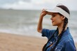 © SHOTPRIME STUDIO - Beauty of Summer: Attractive Caucasian Woman Standing on Sandy Beach, Enjoying Vacation on Sunny Coast