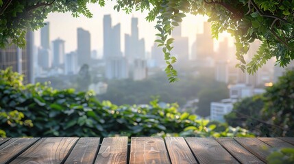 Wood table top on blur of window glass and abstract green from garden with city view in the morning background.