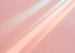 サーモンピンクの背景に虹色の光