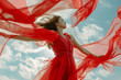 Woman dancing with red flying waving chiffon cloth