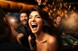 Side view.Asian girl rejoices at winning casino roulette, around her are blurry casino visitors
