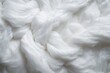 Close up of a white rug with a high shag