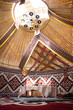 © abramov_jora - Kazak yurt interior with traditional felt carpets and furniture