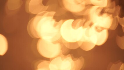 Wall Mural - Abstract Blurred video screensaver bokeh golden sea at sunset. The sun reflects and sparkles on the waves.