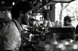 © stardadw007 - Monochrome Portrait of a Thoughtful Barista Working in a Busy City Café