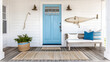 A serene beachside cottage with weathered shiplap walls, a natural fiber rug, and a stunning blue door that invites the ocean breeze inside