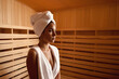 Young woman relaxing and sweating in hot traditional wooden sauna wrapped in towel.  Spa treatment, alternative beauty therapy. Generative ai