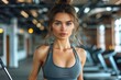 © Martin - Active Lifestyle: Sporty Young Woman with Fitness Tracker Engaged in Gym Workout