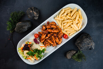 Poster - Pasta with chicken, mushrooms, onions, sweet pepper, sauce and fresh vegetable salad of carrots, lettuce, cabbage and tomatoes.