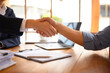© Prathankarnpap - Cropped shot of businesspeople shaking hands after meeting or successful negotiations