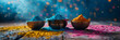 Vibrant powdered colors in bowls on a blue textured background, 
