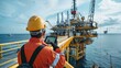 © Annawet boongurd - Operator records the operations of oil and gas processes at oil plants and drilling platforms. Offshore oil and gas industry Operator inspects production process Daily diary as usual.