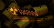 Image of warning text over barrels with radioactive symbol