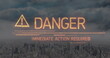Image of danger text over cityscape