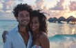 © Daniel - A happy couple embraces on the beach during sunset, with overwater bungalows in the background. They are smiling and enjoying the beautiful, serene tropical setting.