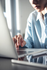 Poster - Young asian business woman thinking about problem solving at work. Casual businesswoman searching the information, working on laptop computer