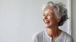 Elegant senior woman Elderly Gray-haired beautiful woman laughing and smiling Older woman with healthy face and white teeth
