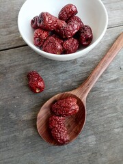 Poster - Dried jujube fruit on wood background