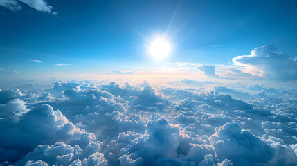 Wall Mural - fluffy white clouds against a blue sky. The sun is shining brightly in the center of the scene.