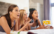 © peopleimages.com - Surprise, watching tv and friends eating popcorn in bedroom for streaming show, relax or amazed together at home. Television, food or group of women with shock in bed for movie, film and wow at party