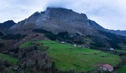 Wall Mural - Aerial drone view of the sunset on Mount Amboto in the Urkiola Natural Park. Arrazola Valley. Bizkaia. Basque Country. Spain. Europe