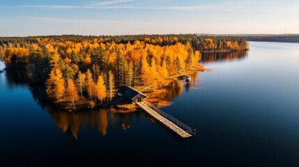 Poster - Aerial view of a yellow autumn forest with a house and a wooden pier on the Lake shore on a sunny day. Landscape, Seasons, Nature, travel endings.
