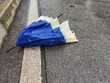 broken umbrella abandoned on the street