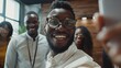 Portrait of smiling african american man taking selfie with friends