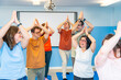 Disabled people having fun during yoga class together