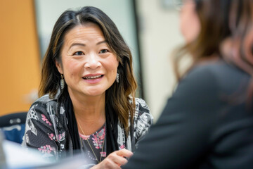 Wall Mural - middle aged asian american woman in office