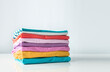 © nys - Colorful coton stack of clothes empty copy space.