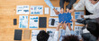 Panorama top view diverse corporate officer worker collaborate in office connect puzzle piece as partnership and teamwork concept. Unity and synergy in business success with jigsaw puzzle. Concord