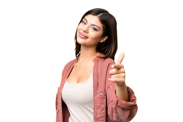 Wall Mural - Young Russian woman over isolated chroma key background pointing front with happy expression