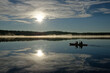© Dieter Decroos - canoeing on lake reflecting mountains