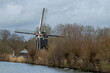 Utrecht, the Netherlands 18 February 2023. Windmill Nieuwegein, mill along the canal