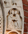 Maria incontra Elisabetta;  arco del portale della basilica di Santa Maria in Calvenzano a Vizzolo Predabissi (Milano)