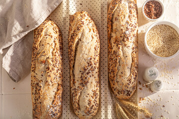 Tasty wholegrain baguettes in a rustic home bakery.