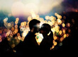 dark silhouette of a kissing couple against abstract multicolored blurred lights,Valentines day,love,relationship,dating,concept image