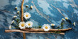 wooden branches with daisies flower symbol of purity,joy and new beginnings,on blue marble surface,copy space for text